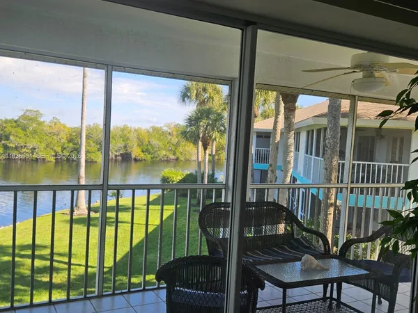 a view of a balcony with furniture
