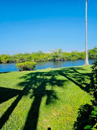a view of a lake with a big yard