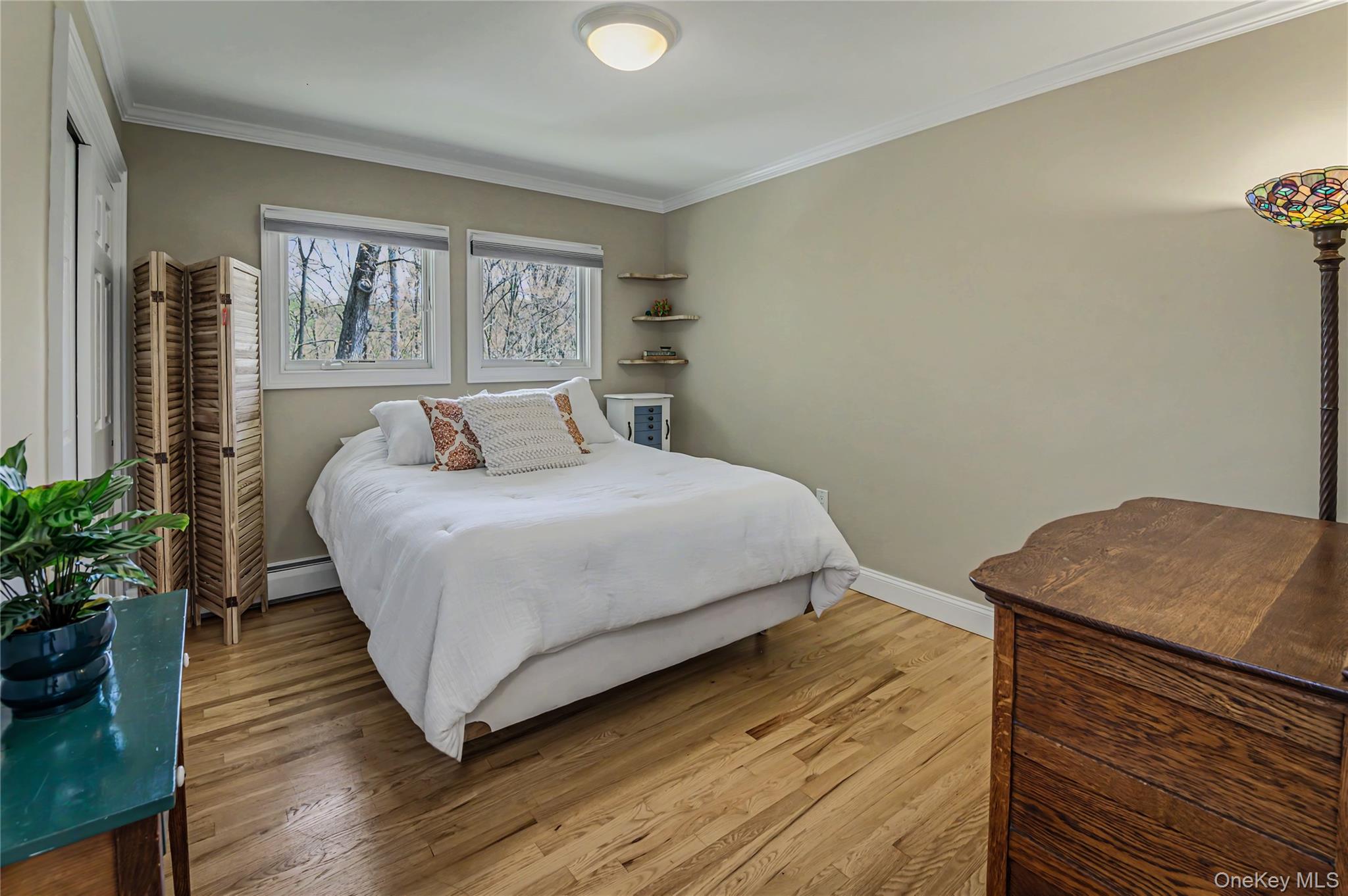 41 Cross Pond Road Pound Ridge, NY 10576 - Photo 25 of 41 a bedroom with a bed and a window