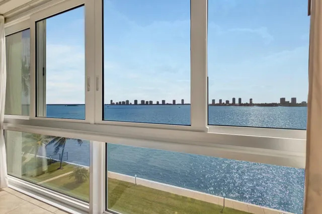 a view of a room with window and cabinet