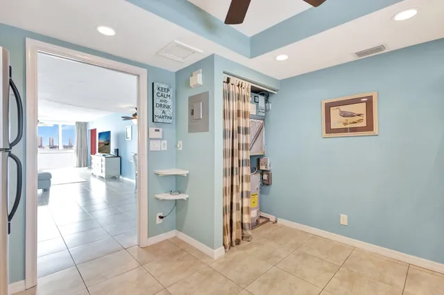 a view of a hallway with wooden floor and a cabinet