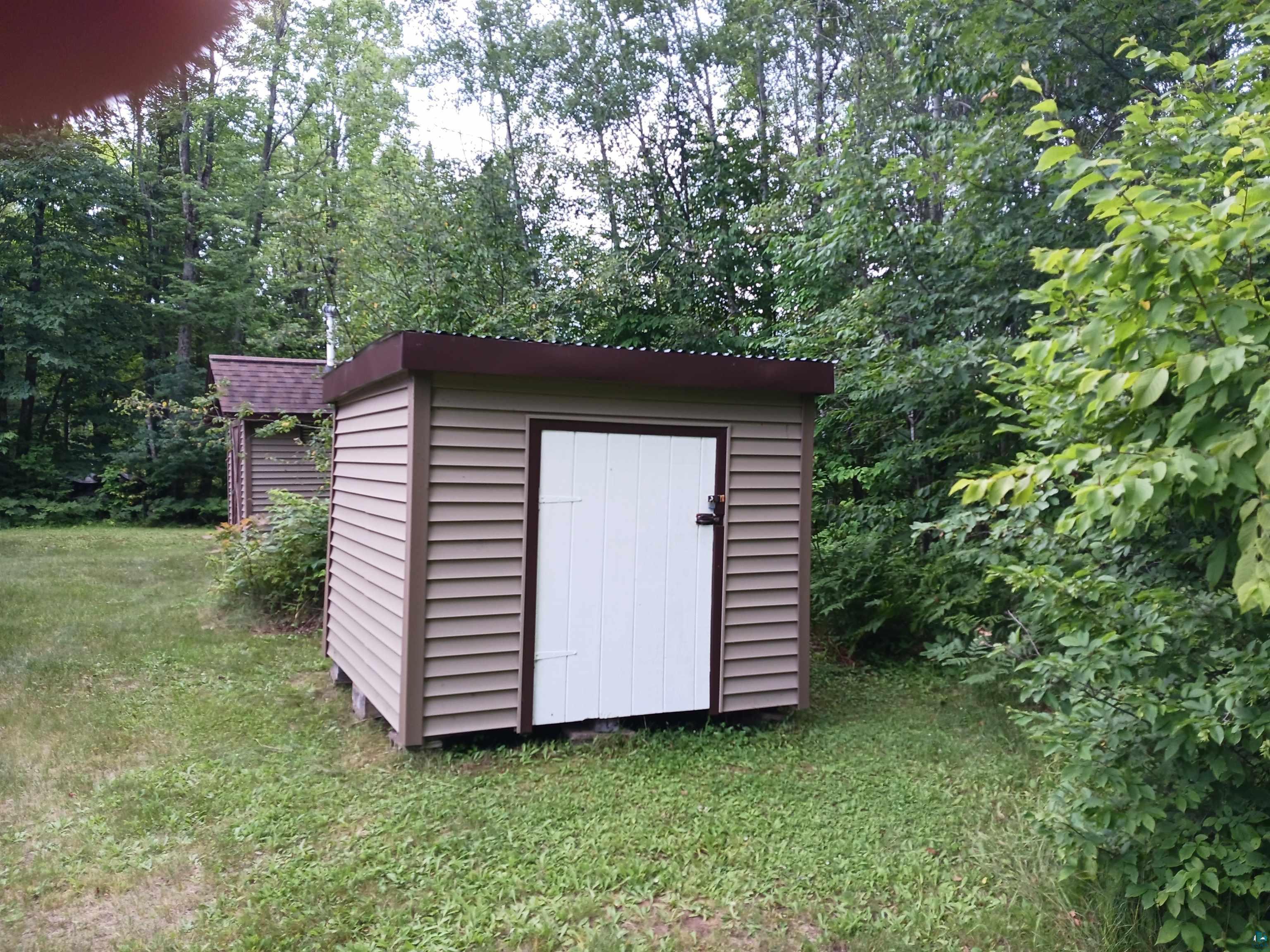 60795 Soderland Road Mason, WI 54856 - Photo 15 of 30 View of outbuilding with a lawn