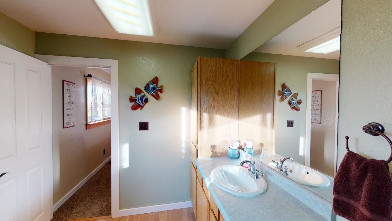 919 21 Road Fruita, CO 81521 - Photo 11 of 27 a living room with furniture and a wooden floor