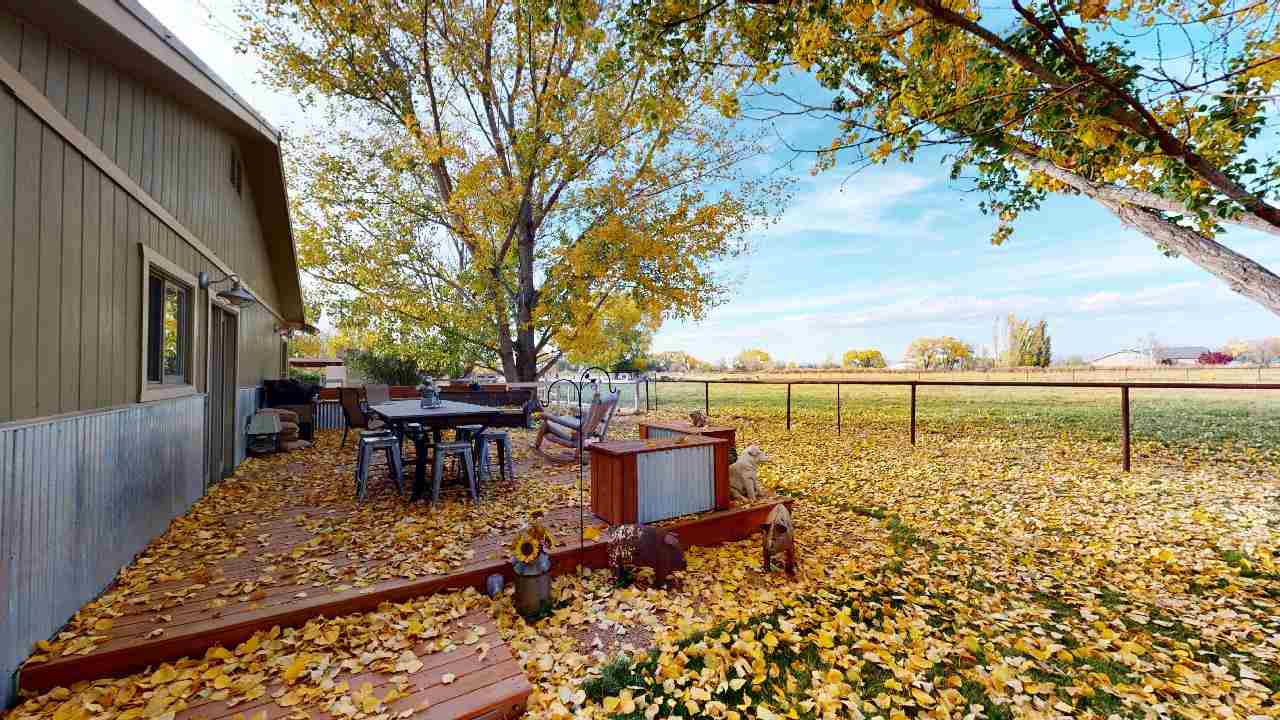919 21 Road Fruita, CO 81521 - Photo 15 of 27 a view of a outdoor space with a table and chairs