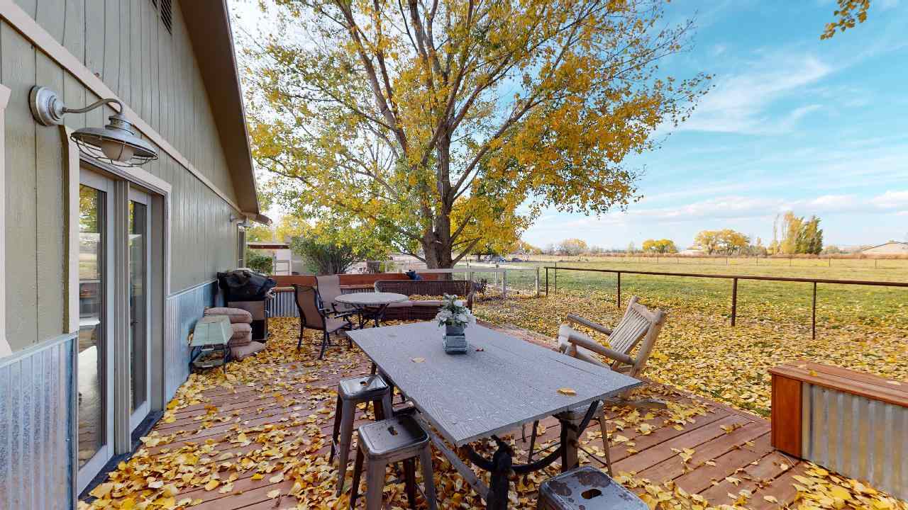 919 21 Road Fruita, CO 81521 - Photo 18 of 27 a balcony with table and chairs