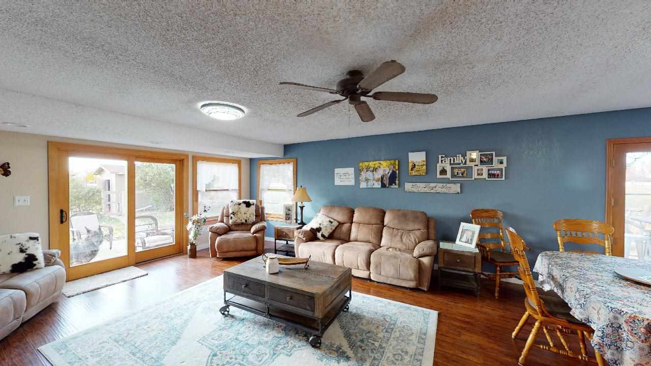 919 21 Road Fruita, CO 81521 - Photo 2 of 27 a living room with furniture and a large window