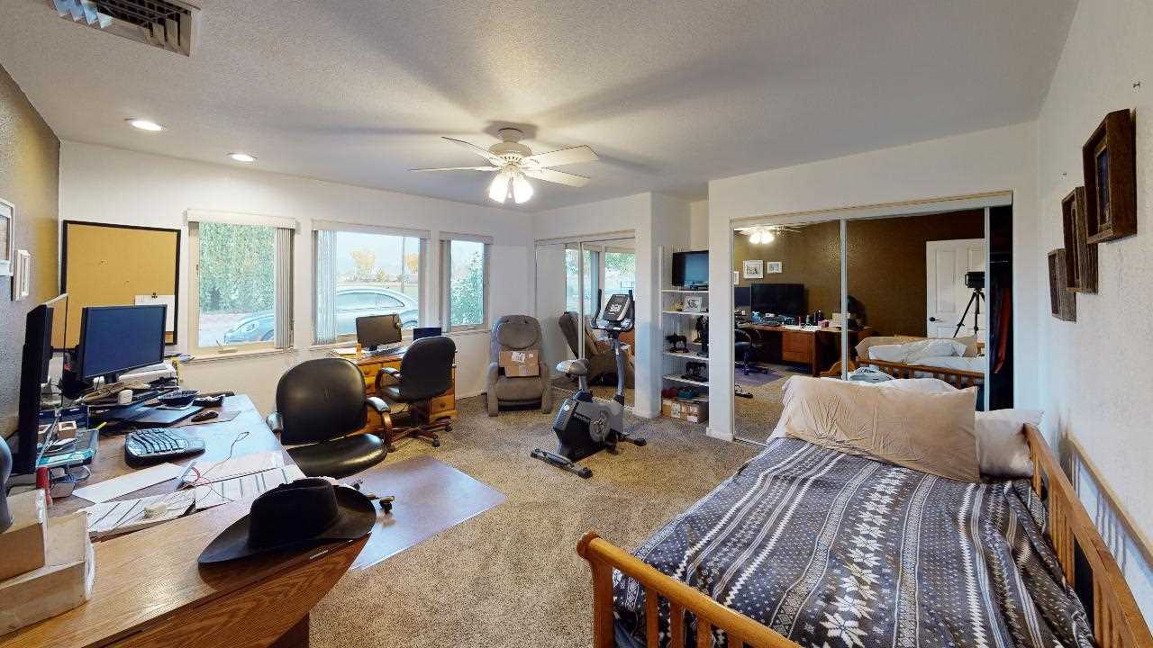 919 21 Road Fruita, CO 81521 - Photo 8 of 27 a living room with furniture and wooden floor