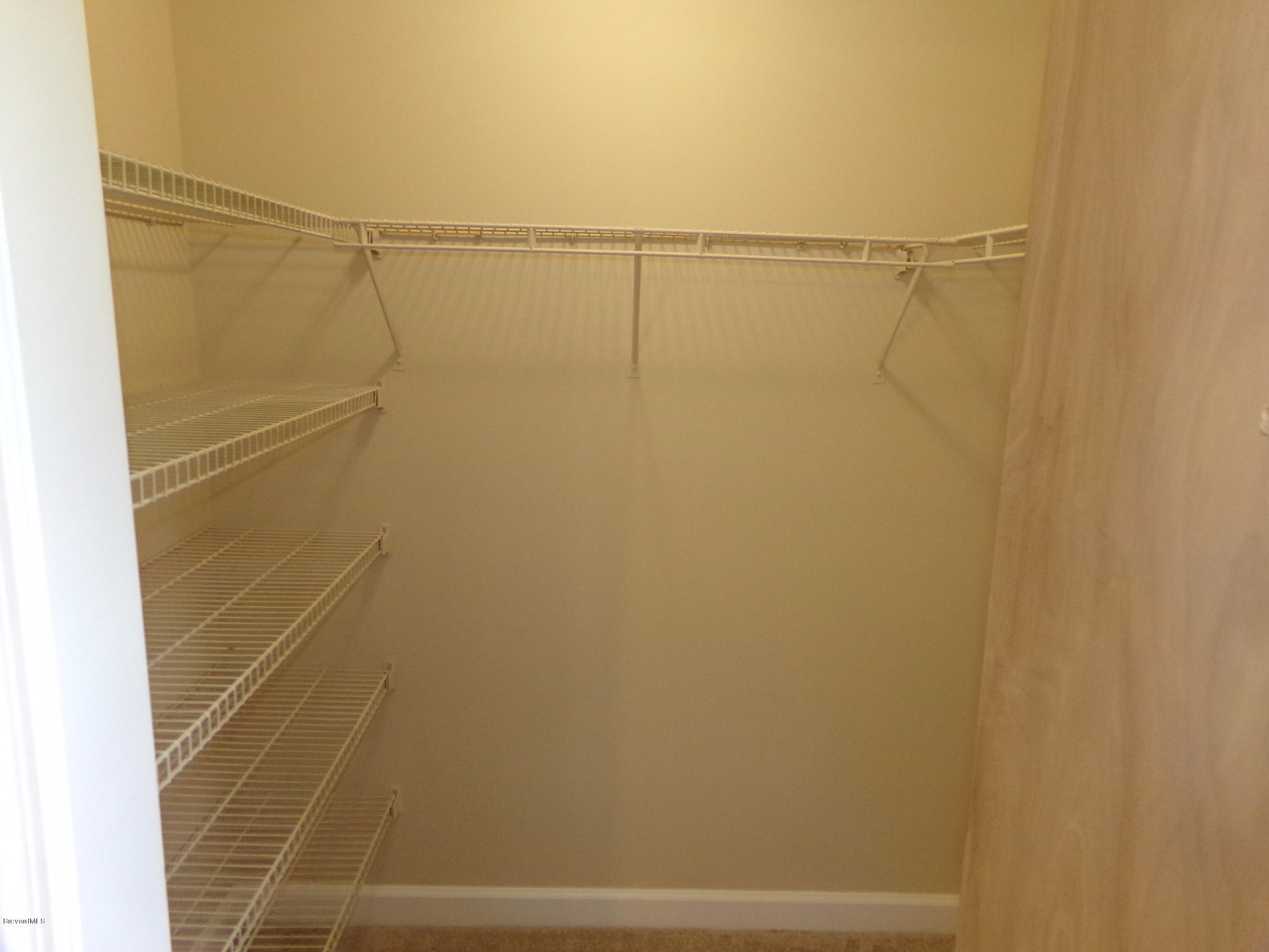 2527 Simon Road Melbourne, FL 32904 - Photo 16 of 27 Guest bedroom 2 walk-in closet