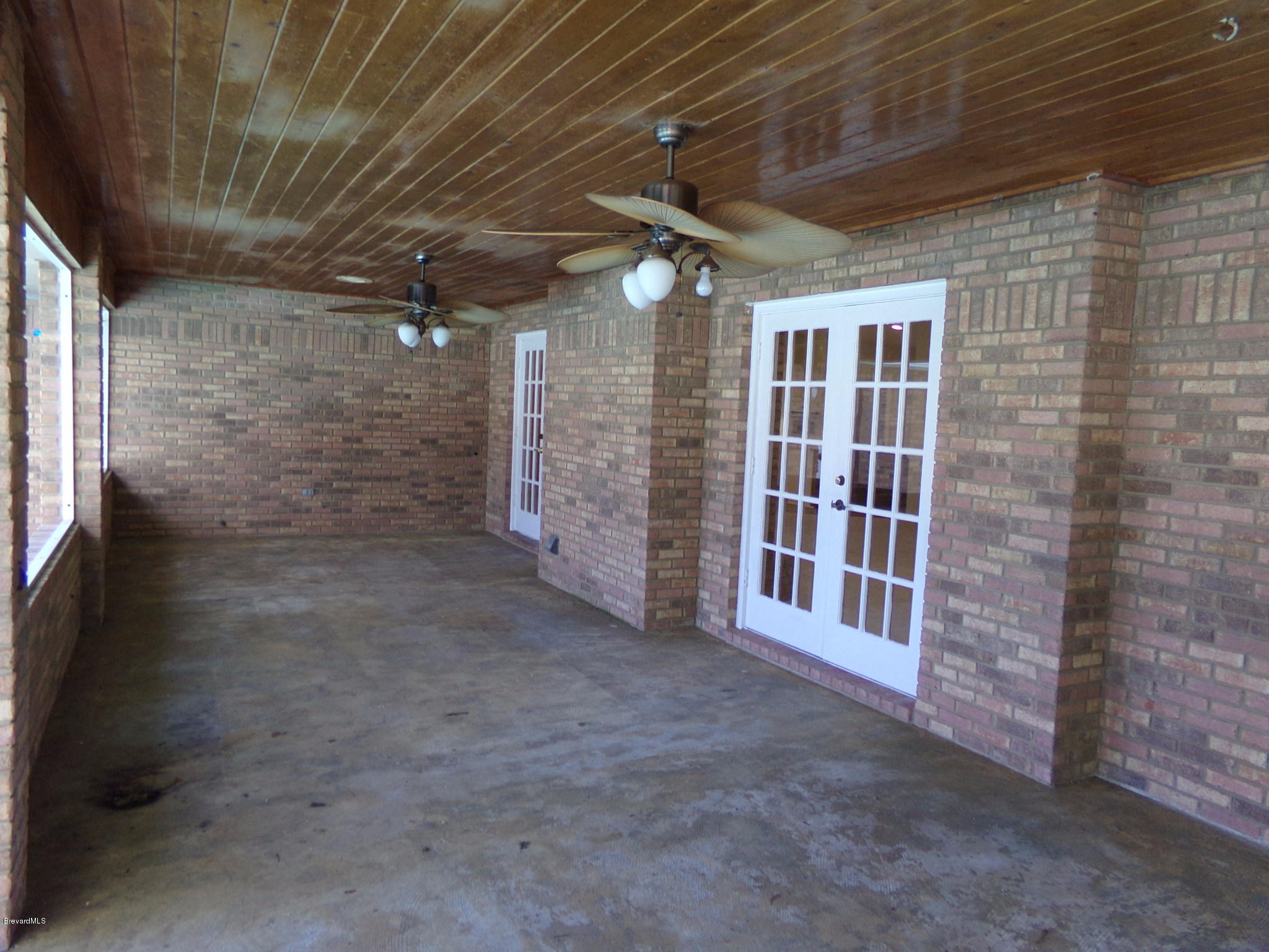 2527 Simon Road Melbourne, FL 32904 - Photo 22 of 27 Screened porch