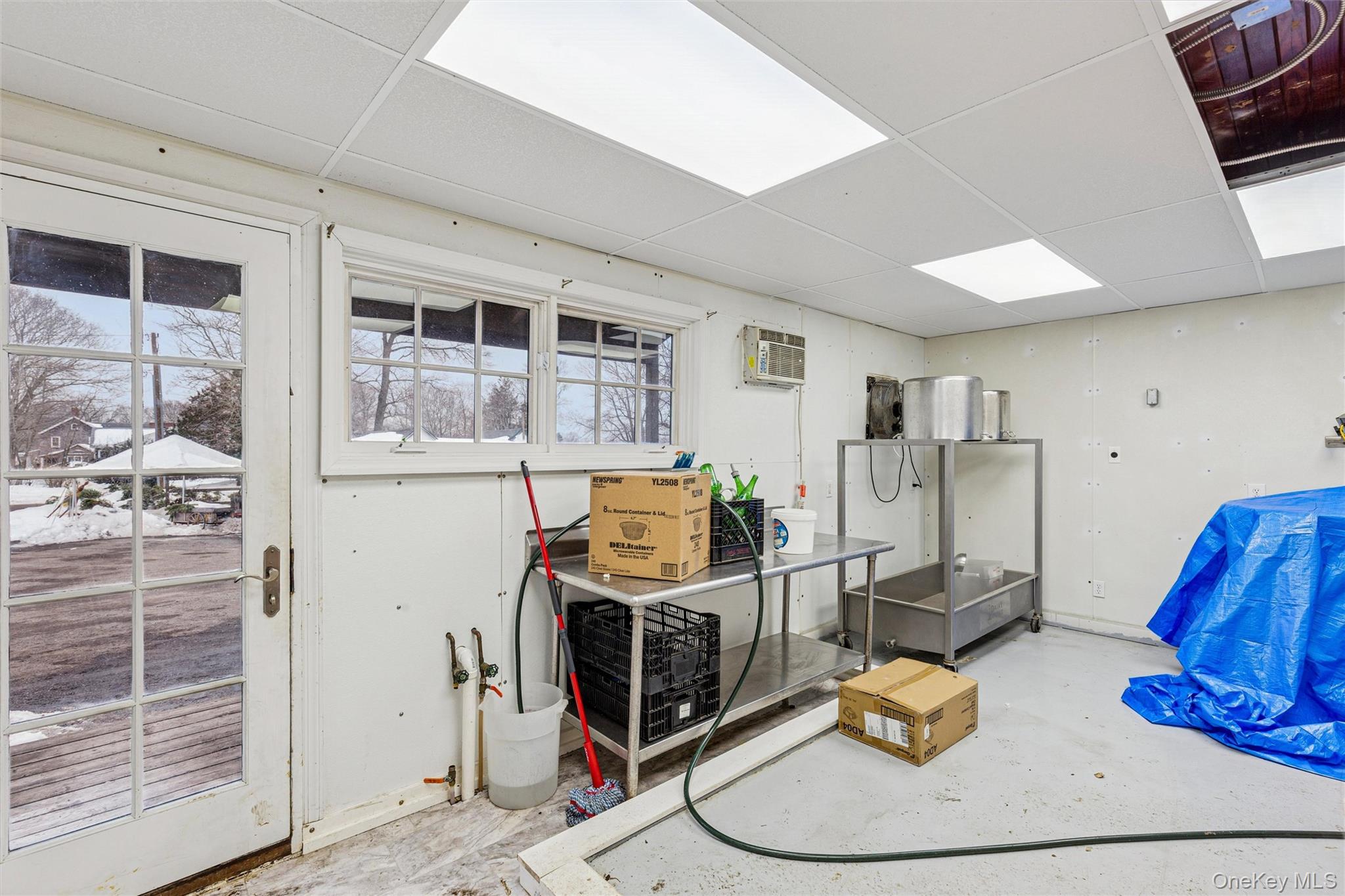 250 Main Road Riverhead, NY 11901 - Photo 10 of 31 a room with furniture and a view of kitchen