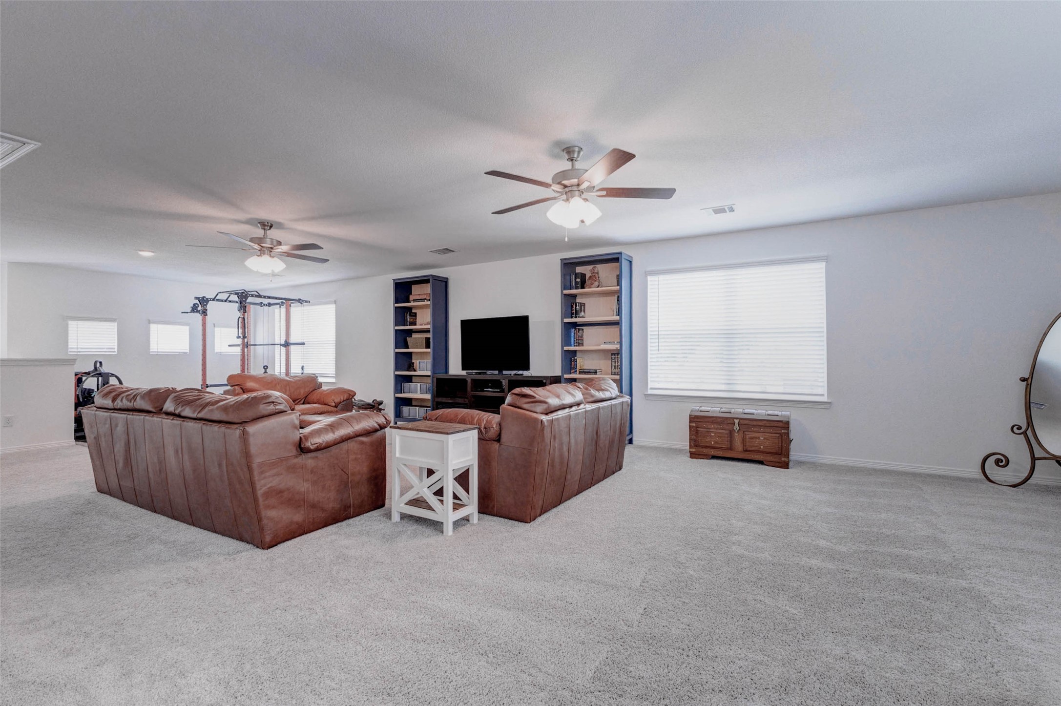 32418 Fly Fish Way Fulshear, TX 77441 - Photo 26 of 40 Whether you envision a media room, play space, home gym, or all of the above, this generously sized space has more than enough room to make it your own.