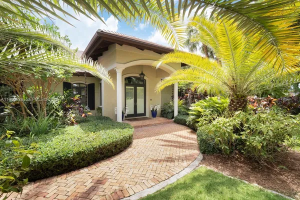 a view of a house with a small yard