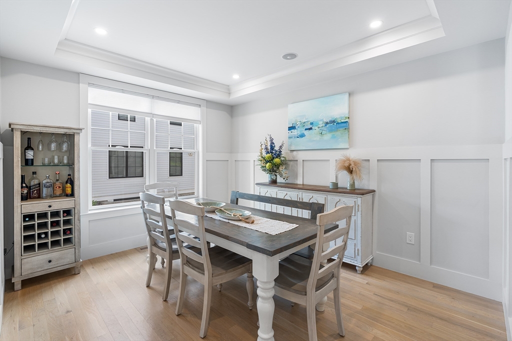 638 Webster Street, Unit 638 Needham, MA 02492 - Photo 11 of 42 a view of a dining room with furniture and wooden floor