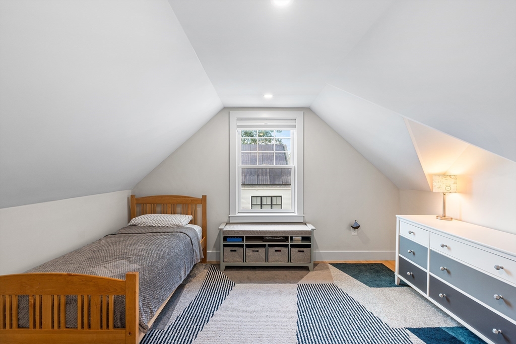 638 Webster Street, Unit 638 Needham, MA 02492 - Photo 28 of 42 a bedroom with a bed and a window