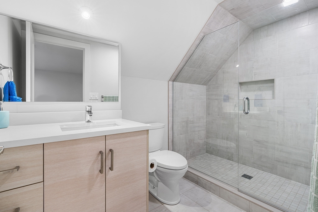 638 Webster Street, Unit 638 Needham, MA 02492 - Photo 30 of 42 a bathroom with a sink toilet and shower