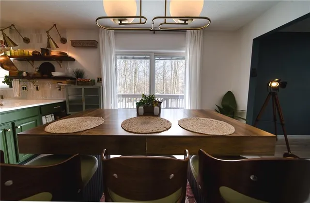 a bathroom with a toilet sink vanity and mirror