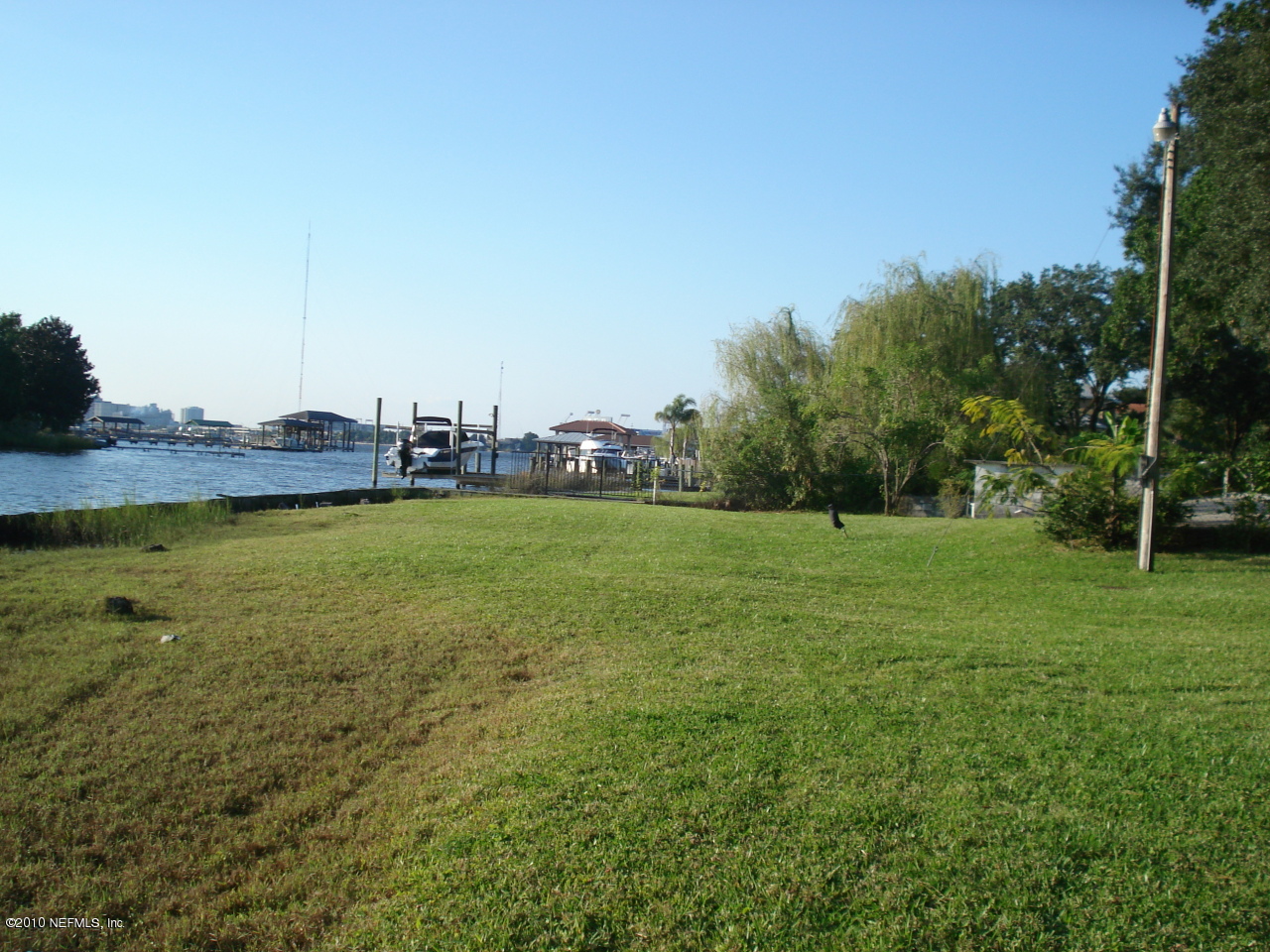 1334 Mayfair Road Jacksonville, FL 32207 - Photo 1 of 4 a view of yard with lake and trees