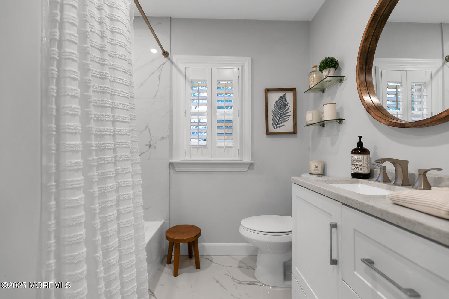 303 Hillside Avenue Atlantic Highlands, NJ 07716 - Photo 14 of 103 a bathroom with a toilet a sink and mirror