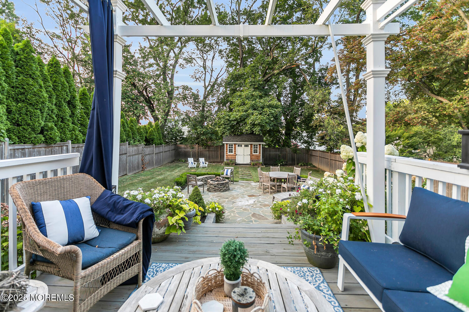 303 Hillside Avenue Atlantic Highlands, NJ 07716 - Photo 29 of 103 a view of a patio with couches chairs and a potted plant