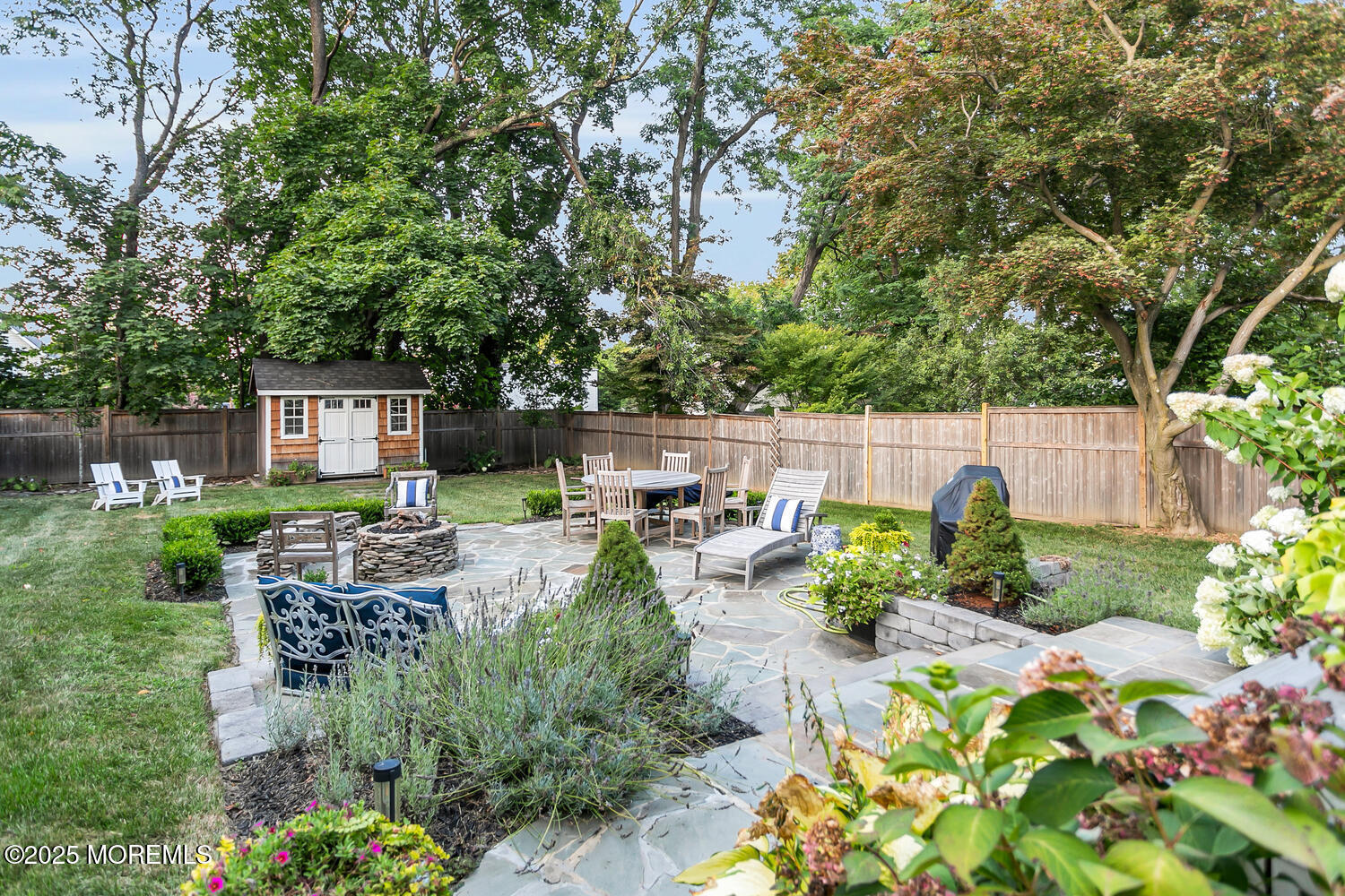 303 Hillside Avenue Atlantic Highlands, NJ 07716 - Photo 30 of 103 a view of a chairs and table in a backyard