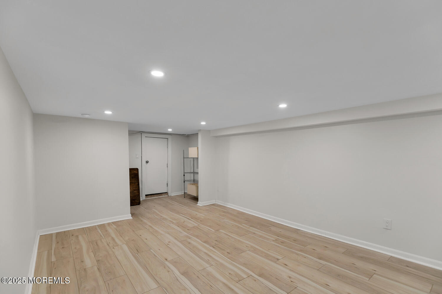 303 Hillside Avenue Atlantic Highlands, NJ 07716 - Photo 37 of 103 a view of an empty room with wooden floor and a window