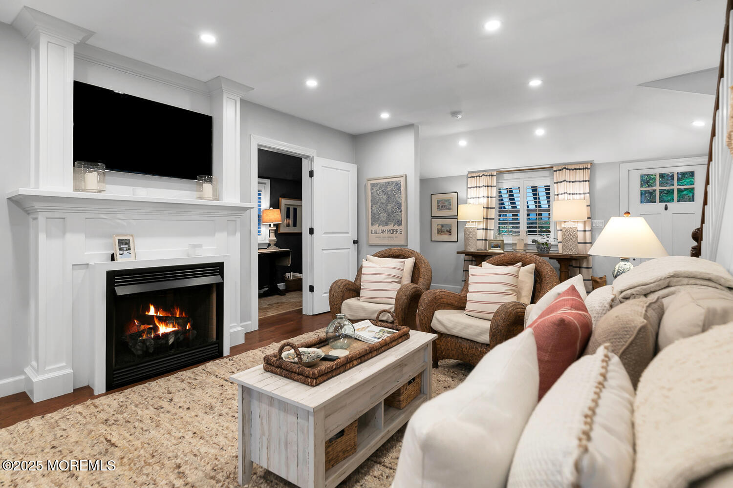 303 Hillside Avenue Atlantic Highlands, NJ 07716 - Photo 40 of 103 a living room with furniture a fireplace and a flat screen tv