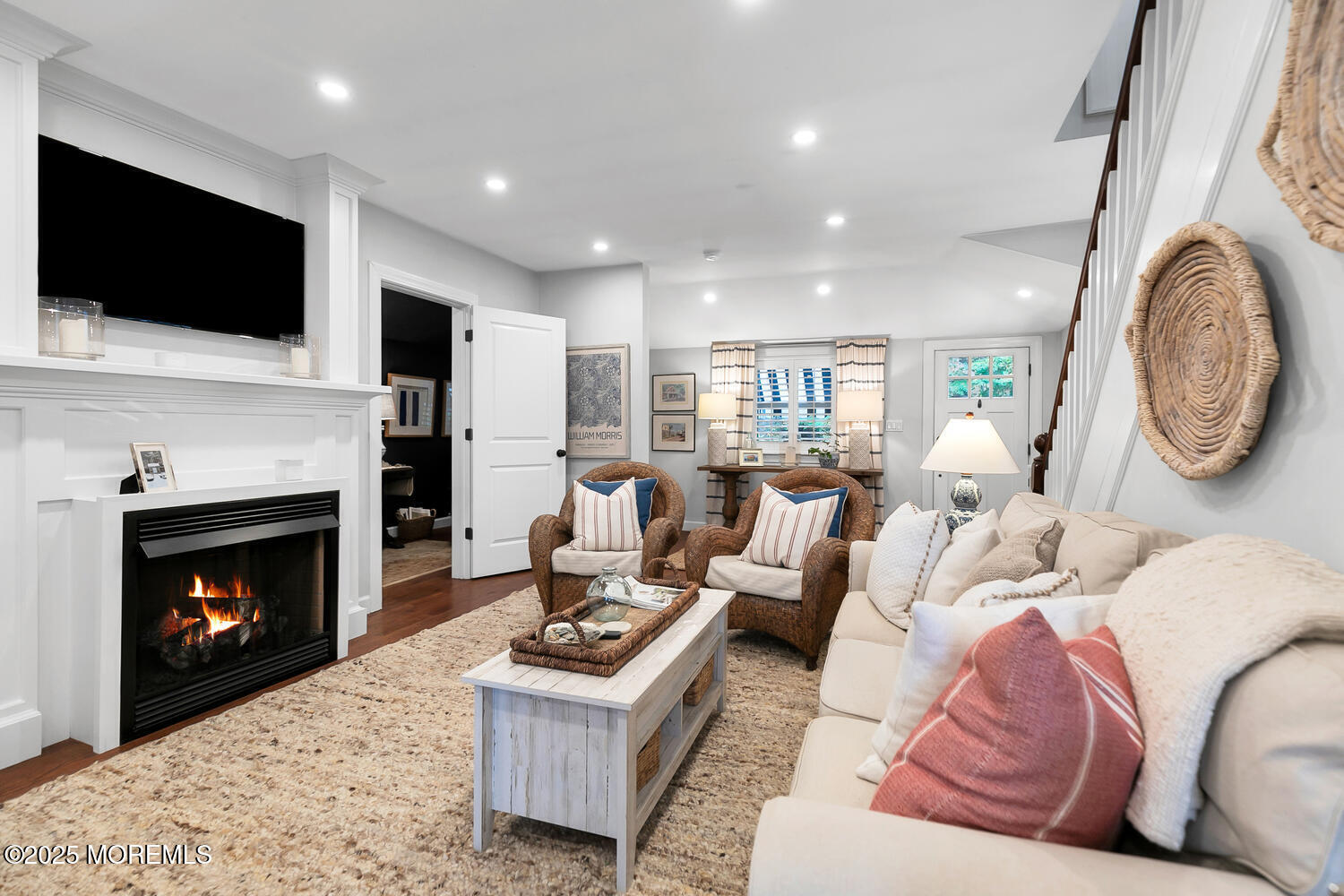 303 Hillside Avenue Atlantic Highlands, NJ 07716 - Photo 4 of 103 a living room with furniture a fireplace and a flat screen tv
