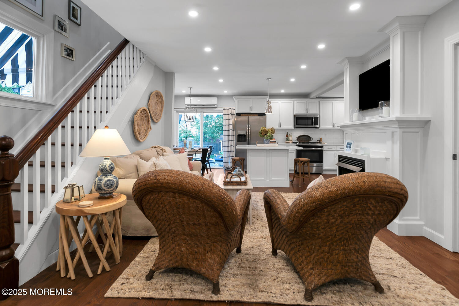 303 Hillside Avenue Atlantic Highlands, NJ 07716 - Photo 53 of 103 a living room with furniture a fireplace and a flat screen tv