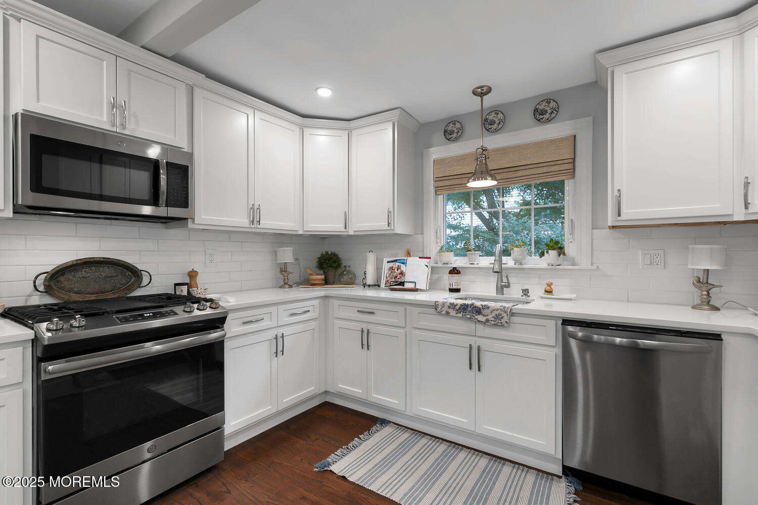 303 Hillside Avenue Atlantic Highlands, NJ 07716 - Photo 58 of 103 a kitchen with stainless steel appliances granite countertop white cabinets a sink and a stove