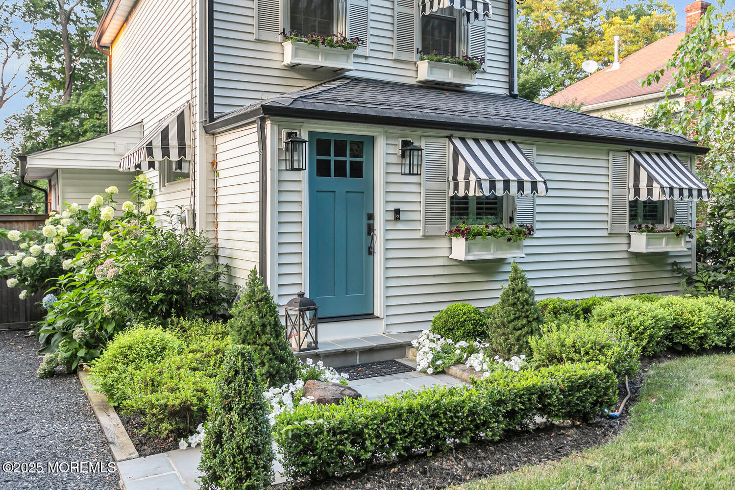 303 Hillside Avenue Atlantic Highlands, NJ 07716 - Photo 67 of 103 a view of a house with potted plants and a table and chair