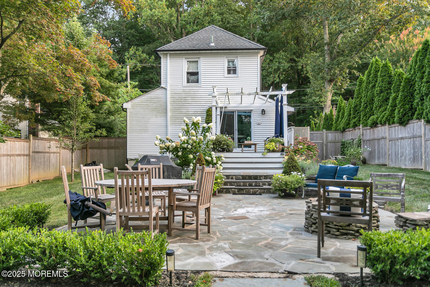 303 Hillside Avenue Atlantic Highlands, NJ 07716 - Photo 75 of 103 a view of a chair and table in backyard of the house