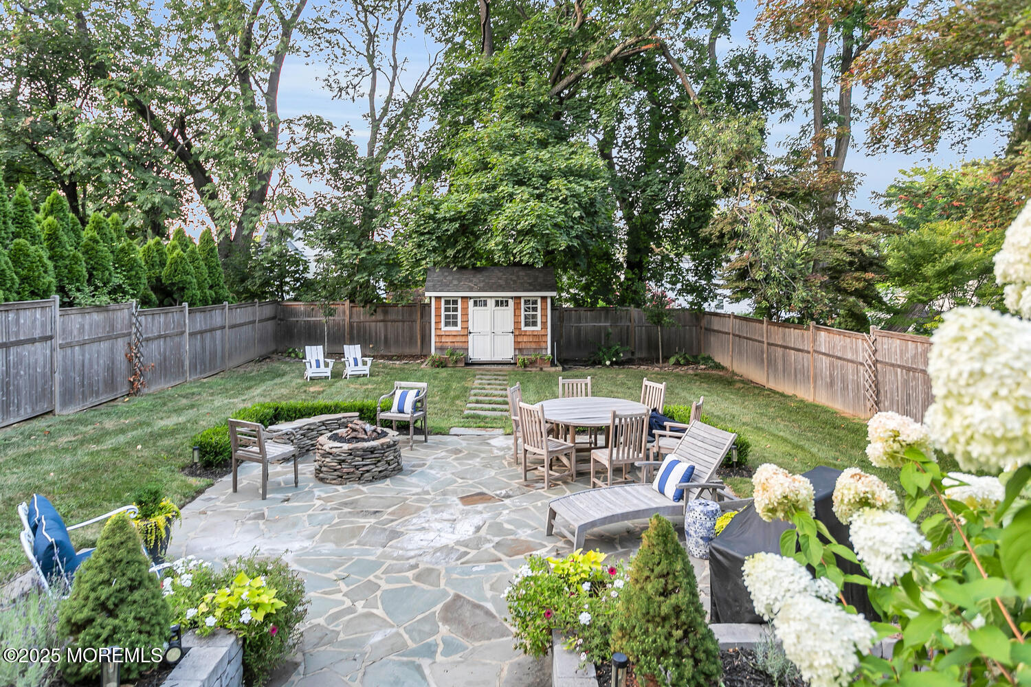 303 Hillside Avenue Atlantic Highlands, NJ 07716 - Photo 79 of 103 a view of a chair and table in backyard of the house