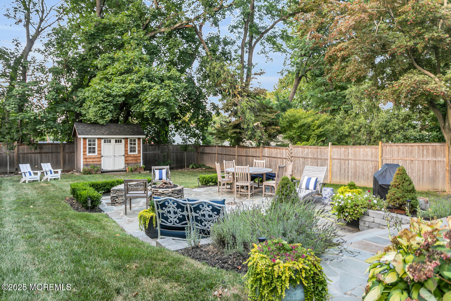 303 Hillside Avenue Atlantic Highlands, NJ 07716 - Photo 83 of 103 a view of a chairs and table in backyard