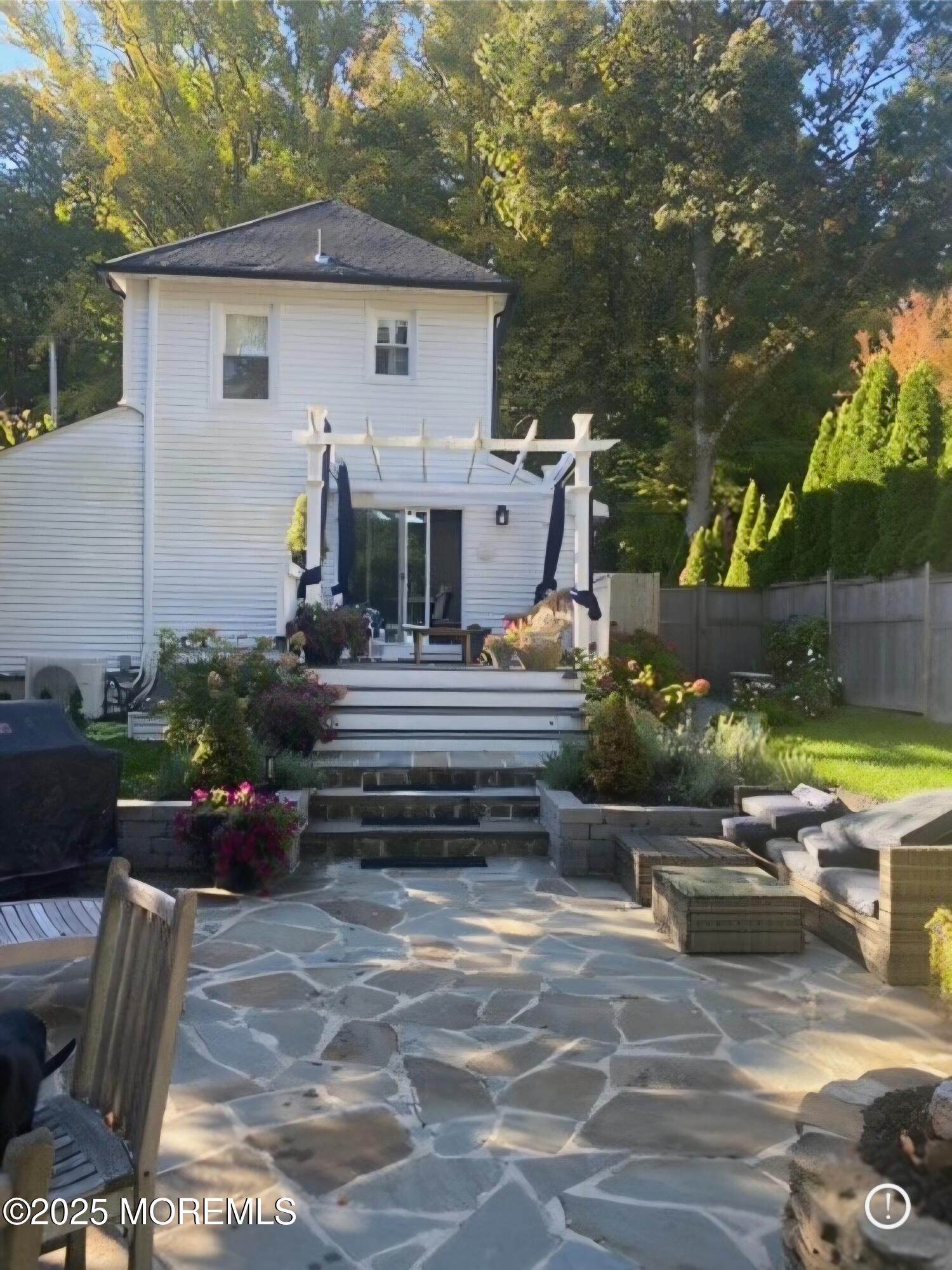 303 Hillside Avenue Atlantic Highlands, NJ 07716 - Photo 97 of 103 a front view of a house with garden