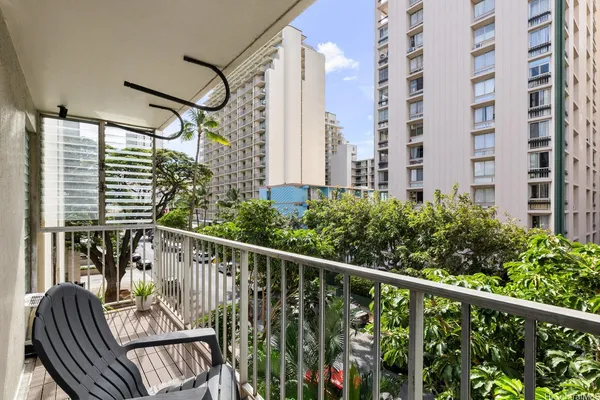 a view of a balcony with chairs