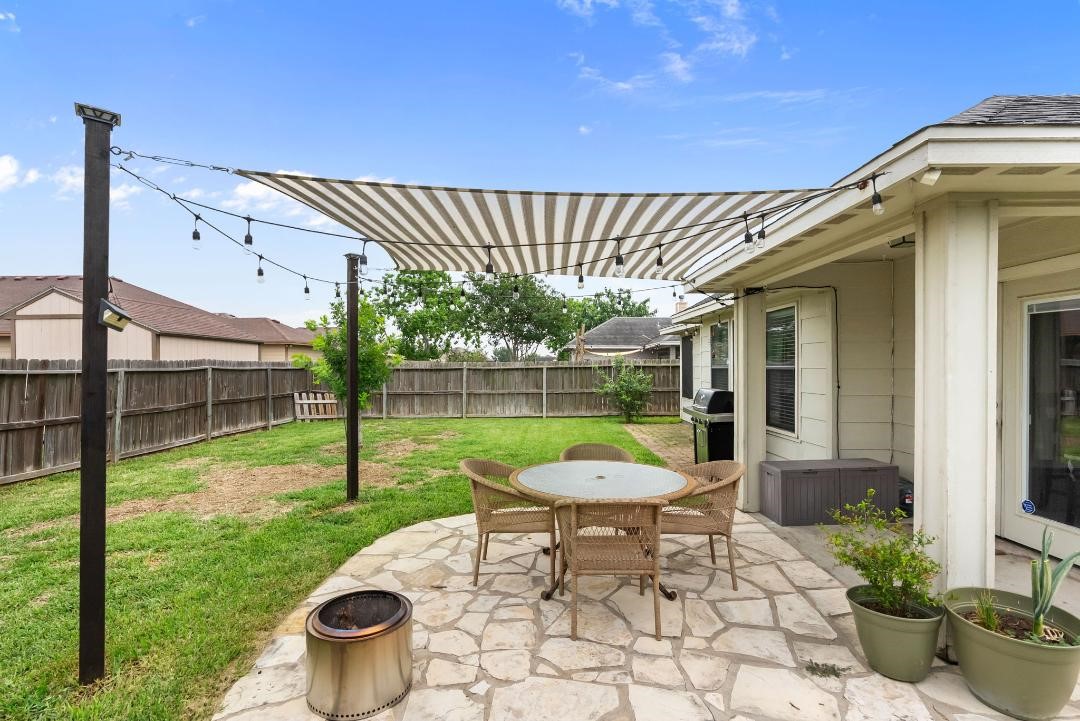4328 Bratton Road Corpus Christi, TX 78413 - Photo 22 of 24 a view of a house with backyard sitting area and garden