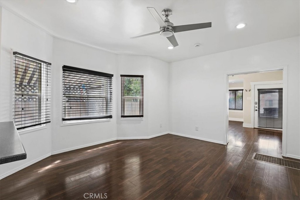 1352 Elm Avenue Long Beach, CA 90813 - Photo 24 of 71 a view of an empty room with wooden floor and a window