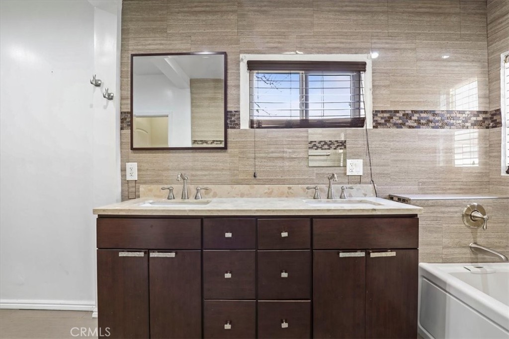 1352 Elm Avenue Long Beach, CA 90813 - Photo 35 of 71 a bathroom with a sink and a mirror