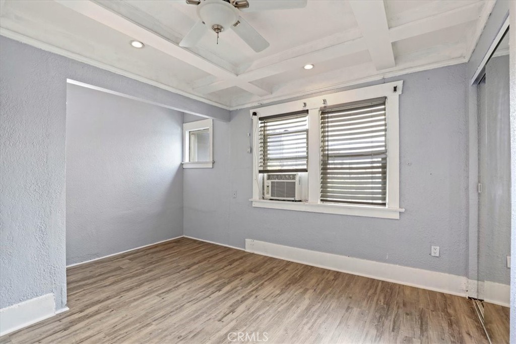 1352 Elm Avenue Long Beach, CA 90813 - Photo 38 of 71 a view of an empty room with wooden floor and a window