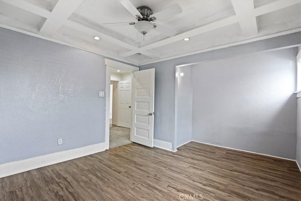 1352 Elm Avenue Long Beach, CA 90813 - Photo 39 of 71 an empty room with wooden floor and ceiling fan