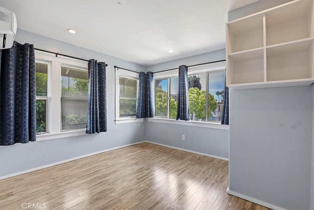 1352 Elm Avenue Long Beach, CA 90813 - Photo 40 of 71 a view of an empty room with wooden floor and a window