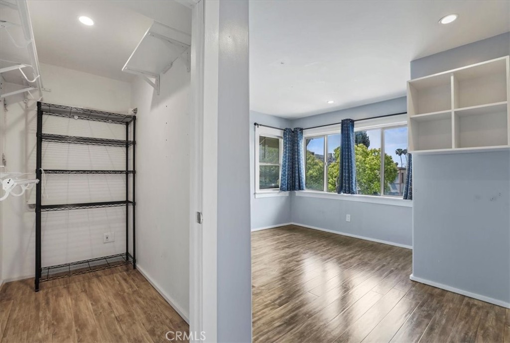 1352 Elm Avenue Long Beach, CA 90813 - Photo 42 of 71 an empty room with wooden floor and windows