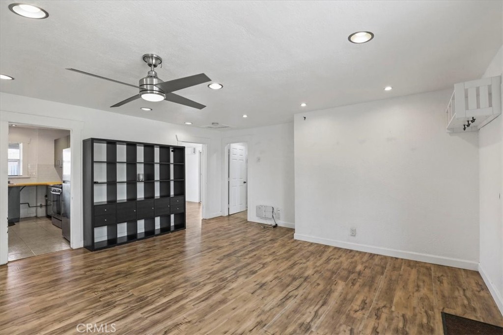 1352 Elm Avenue Long Beach, CA 90813 - Photo 46 of 71 an empty room with wooden floor fan and windows