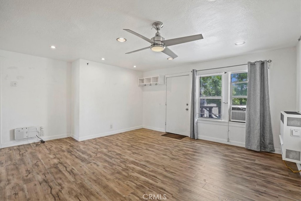 1352 Elm Avenue Long Beach, CA 90813 - Photo 47 of 71 a view of empty room with wooden floor and fan