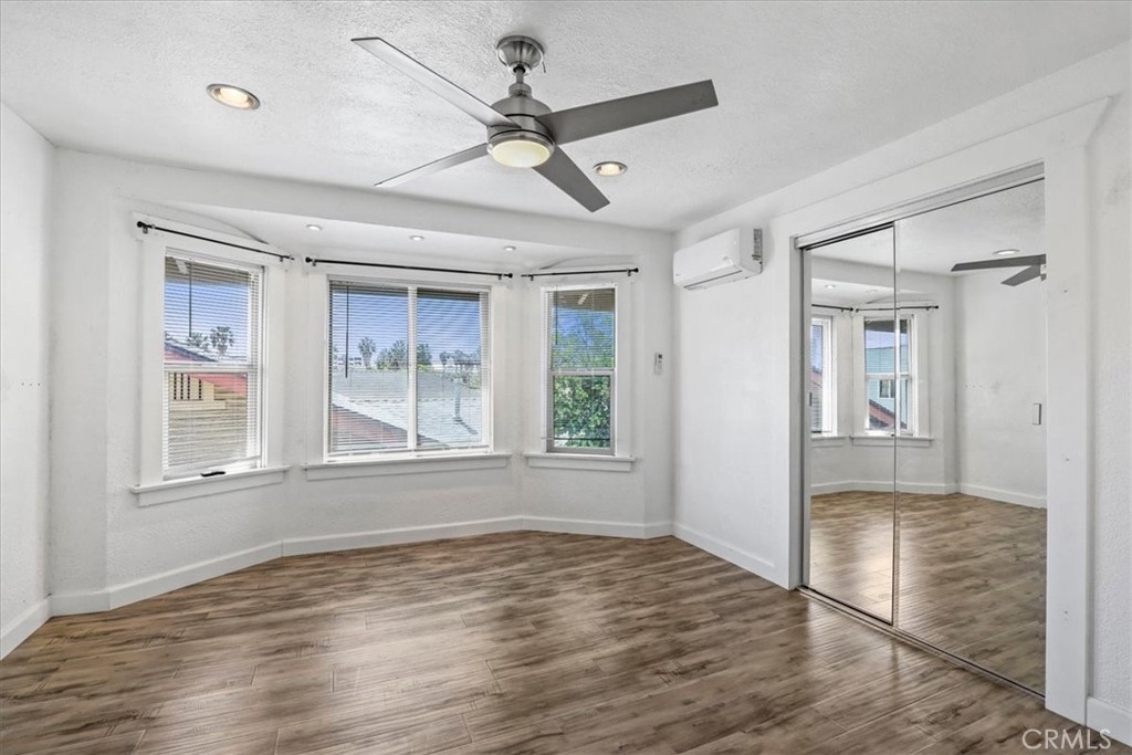1352 Elm Avenue Long Beach, CA 90813 - Photo 48 of 71 a view of empty room with wooden floor and fan
