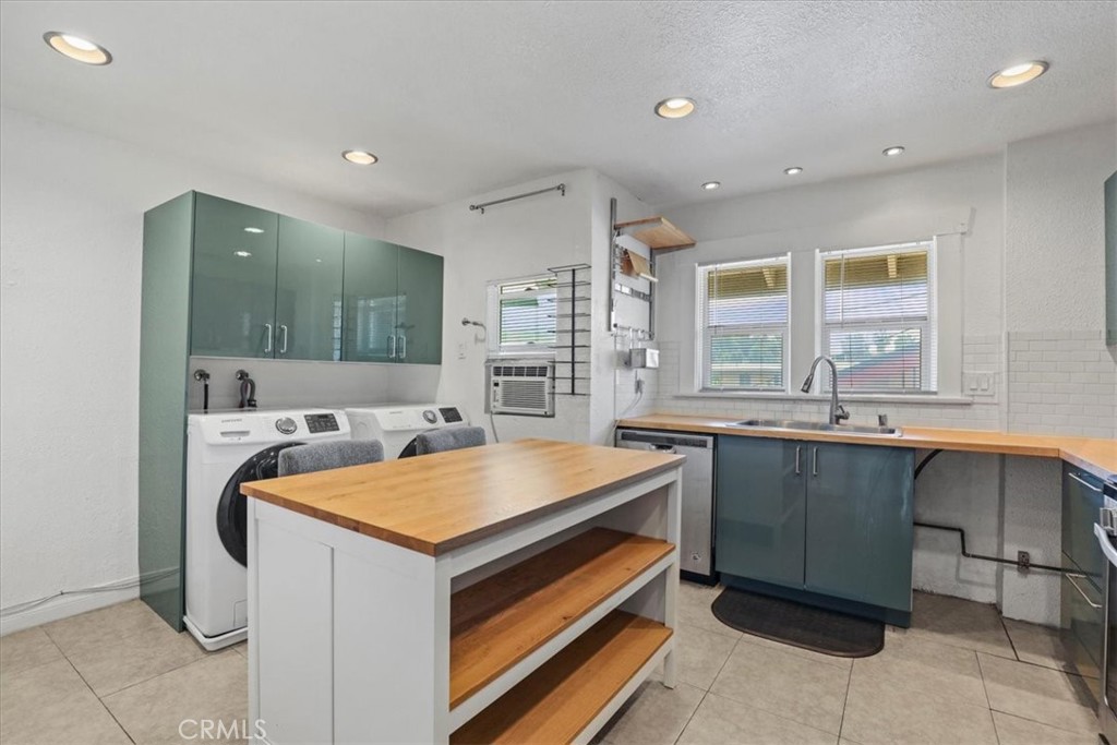 1352 Elm Avenue Long Beach, CA 90813 - Photo 50 of 71 a kitchen that has a sink and a stove in it