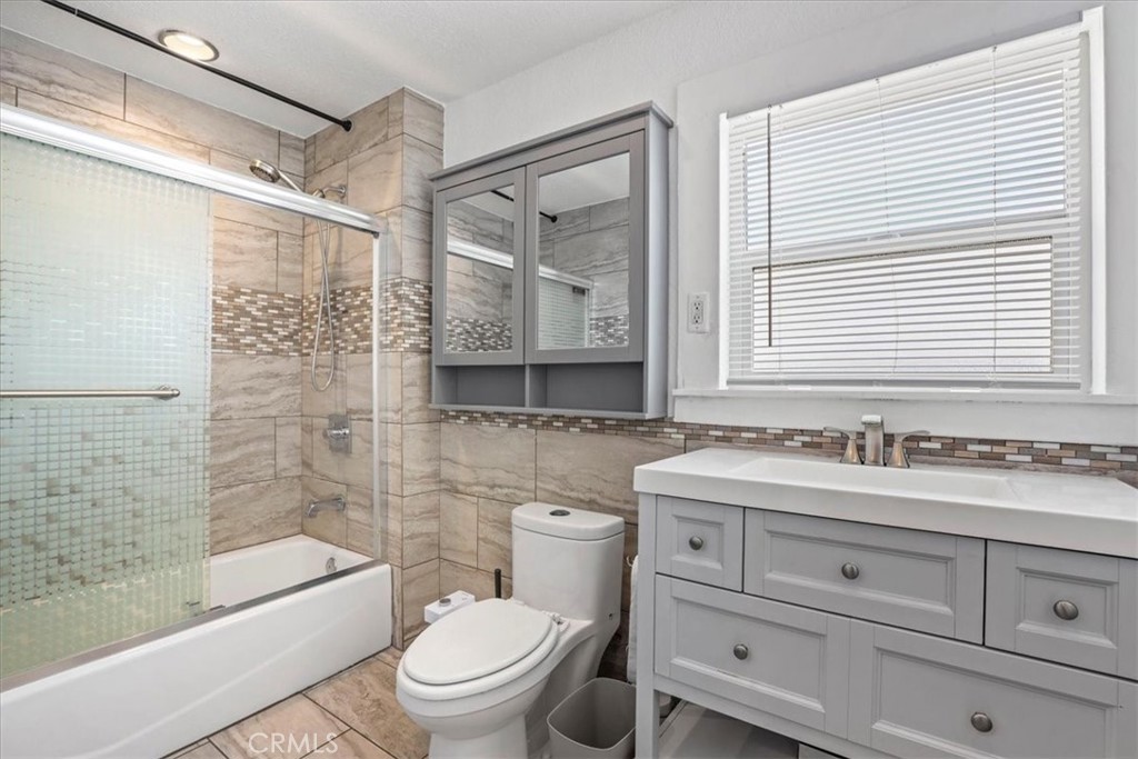 1352 Elm Avenue Long Beach, CA 90813 - Photo 55 of 71 a bathroom with a sink a toilet and shower