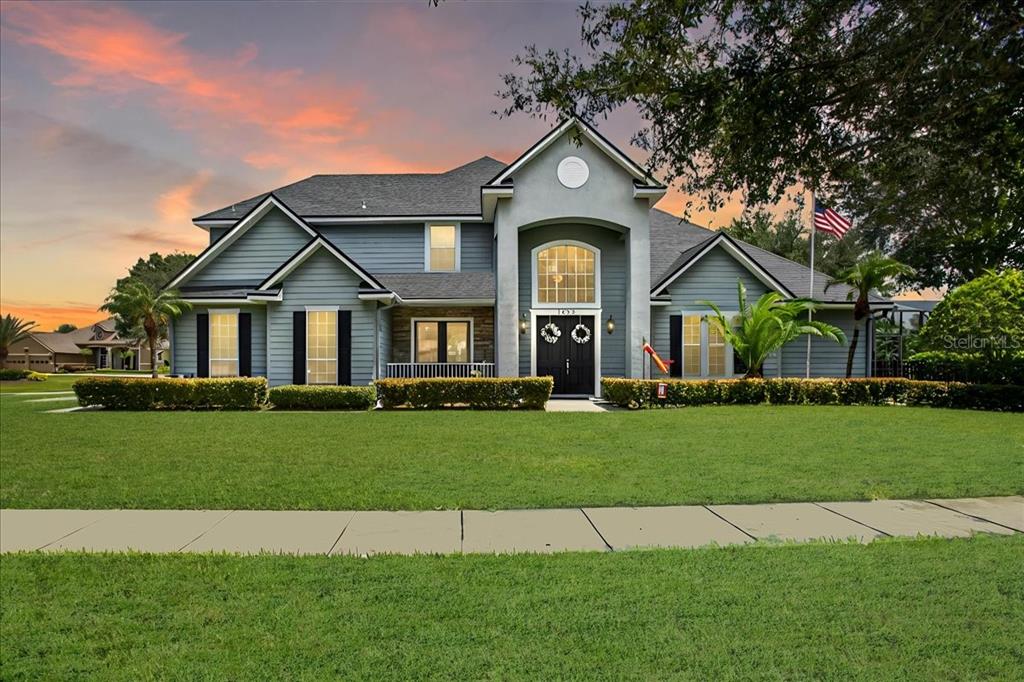 1652 Taylor Ridge Loop Kissimmee, FL 34744 - Photo 1 of 1 a front view of a house with a yard