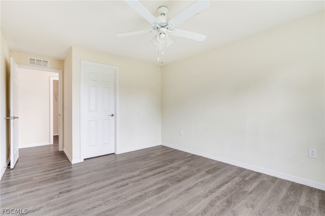 1405 Inwood Road LaBelle, FL 33935 - Photo 15 of 35 wooden floor in an empty room