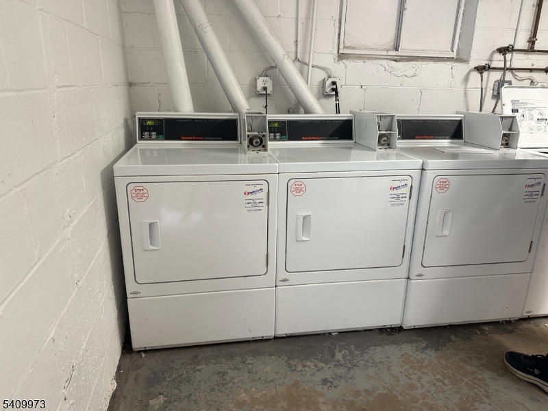 88 Boulevard, Unit 207 Passaic, NJ 07055 - Photo 13 of 13 a utility room with dryer and washer
